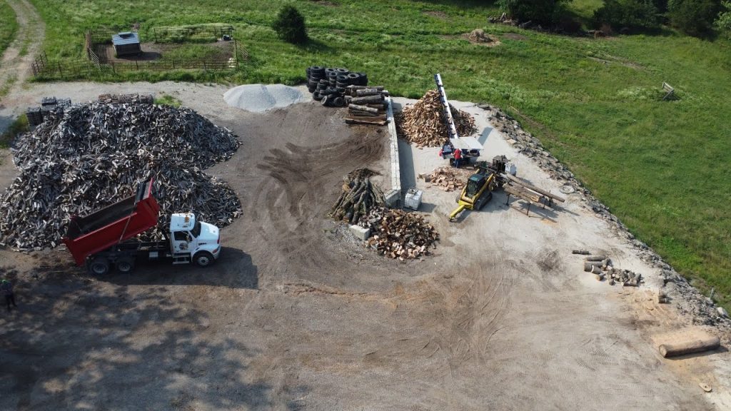 A truck loaded with wood showcases Ralph’s Ranks Firewood, perfect for those looking to build a brand in the firewood business.