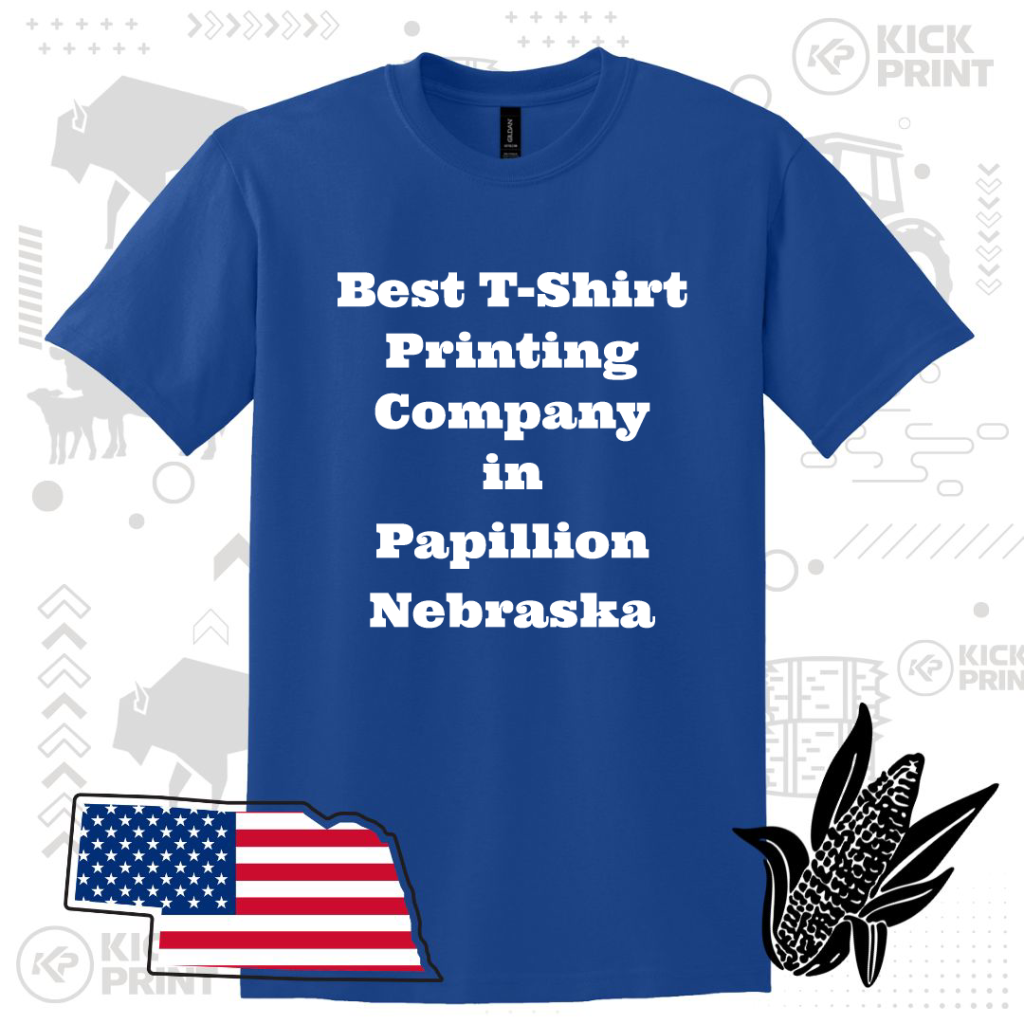 A blue t-shirt with bold white text that reads Best T-Shirt Printing Company in Papillion Nebraska. Surrounding the shirt are graphics of a Nebraska state outline with an American flag, corn, and various icons in the background.