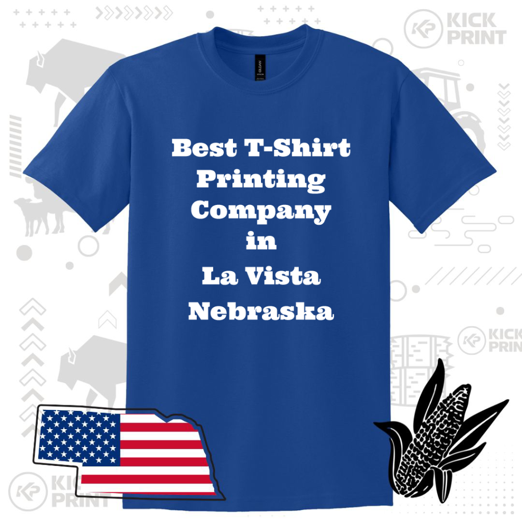A blue t-shirt with white text that reads, Best T-Shirt Printing Company in La Vista Nebraska. Background includes outlines of Nebraska, an American flag, a corn illustration, and faint graphics.