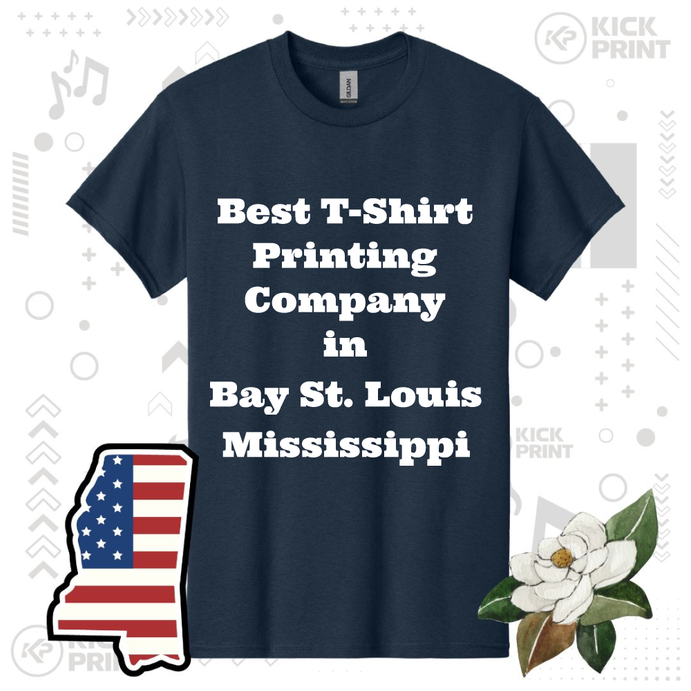 A navy blue T-shirt with the text Best T-Shirt Printing Company in Bay St. Louis Mississippi. Decorated with an illustrated Mississippi state outline, an American flag, and a white magnolia flower.