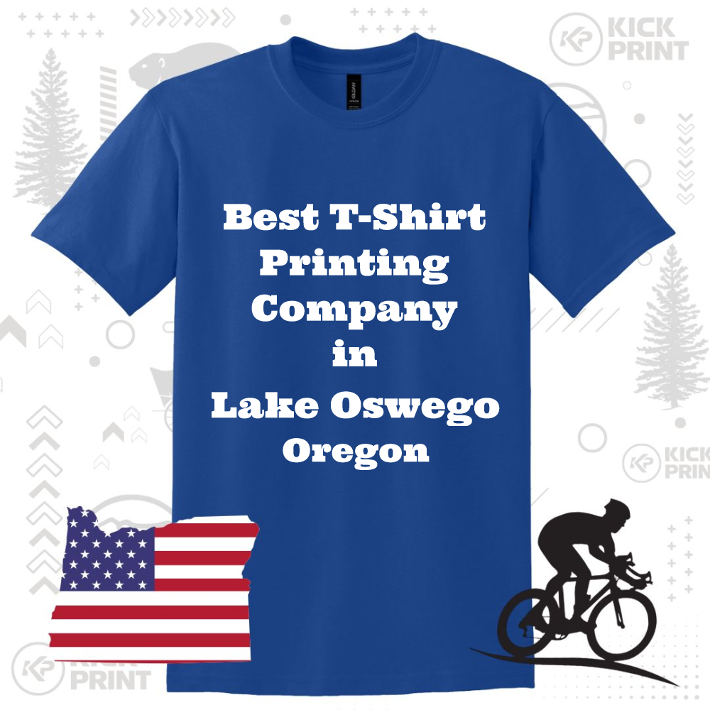 A blue T-shirt with white text that reads Best T-Shirt Printing Company in Lake Oswego Oregon. The background includes an outline of Oregon with a US flag, a cyclist graphic, and subtle logo elements.