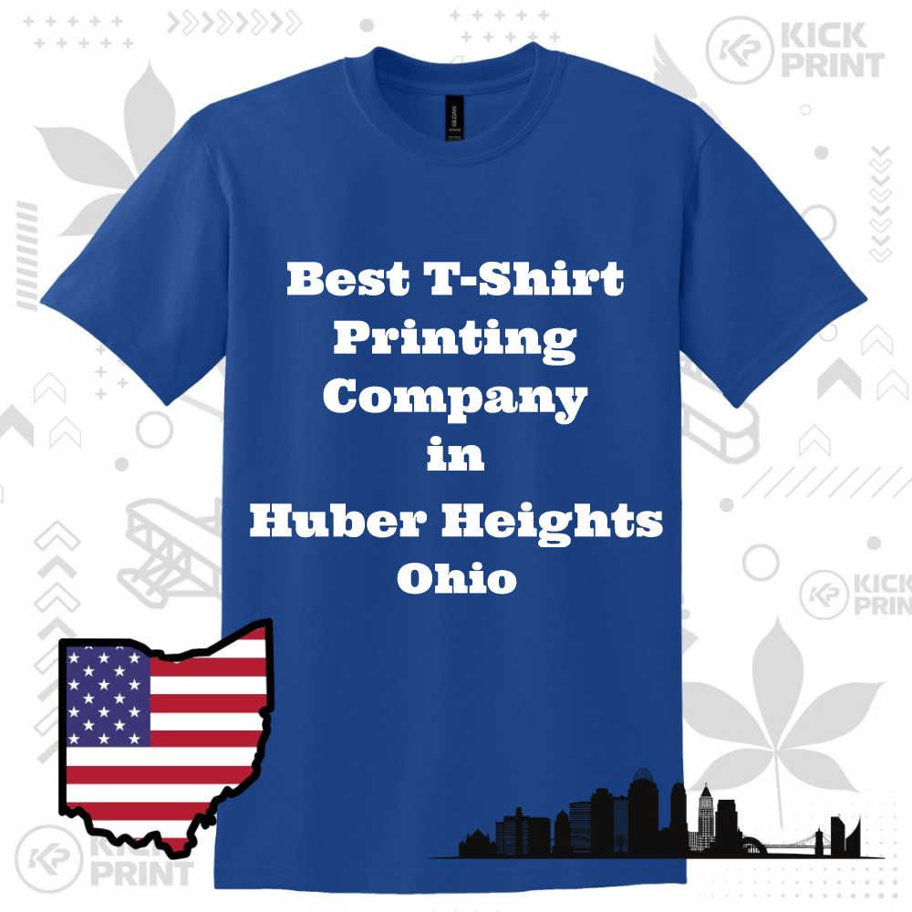 A blue t-shirt with the text Best T-Shirt Printing Company in Huber Heights Ohio in bold white letters. Also shown are an Ohio state outline with an American flag and a city skyline silhouette.