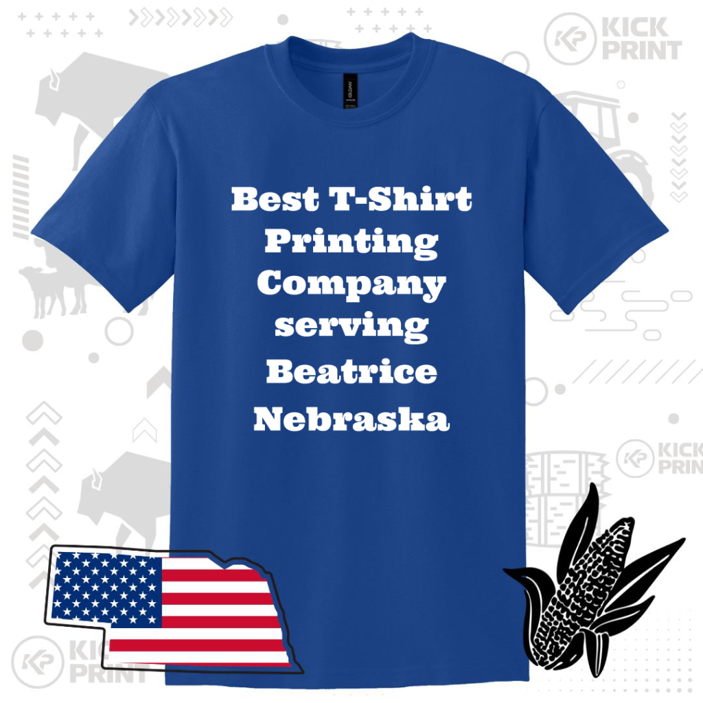 A blue T-shirt with bold white text reading Best T-Shirt Printing Company serving Beatrice Nebraska, surrounded by graphics of the Nebraska state outline with a US flag, an ear of corn, and farm-themed icons.