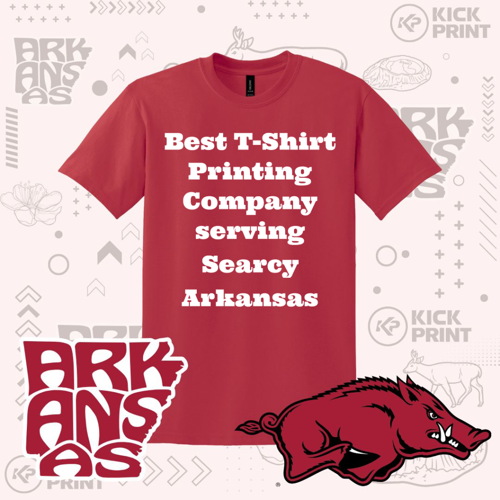 A red t-shirt with the text Best T-Shirt Printing Company serving Searcy Arkansas in bold white letters. Background features Arkansas-themed graphics, “Arkansas” text, a hog mascot, and the Kick Print logo.