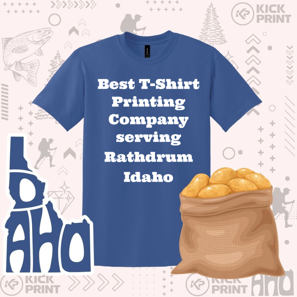A blue T-shirt with the text Best T-Shirt Printing Company serving Rathdrum Idaho is displayed. Next to it is a sack of potatoes, abstract mountain and tree shapes, and the words Lo AHO.