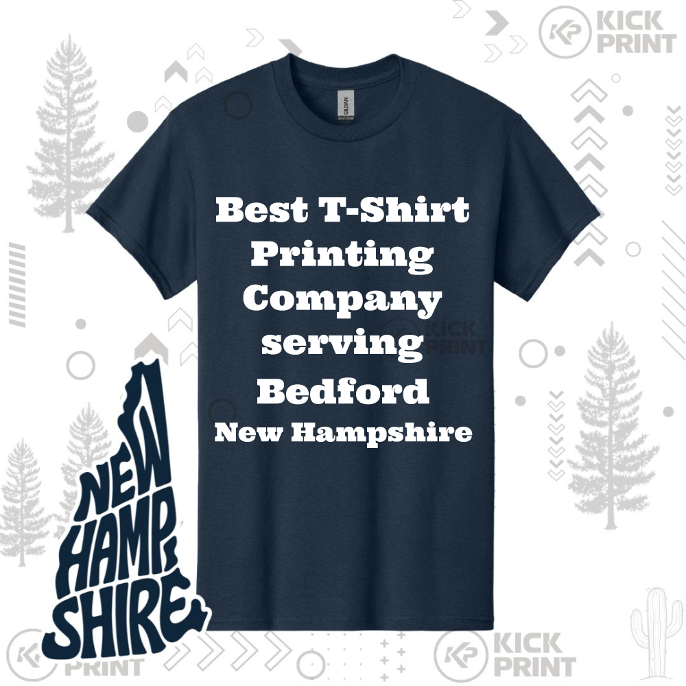 A navy blue T-shirt with bold white text that reads: Best T-Shirt Printing Company serving Bedford New Hampshire. The background includes stylized tree graphics and NEW HAMPSHIRE written in large letters on the left side.